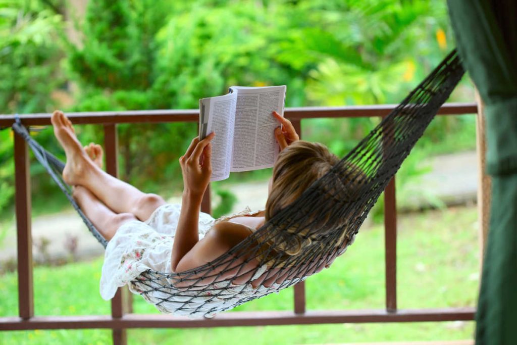 reading book in a hammock
